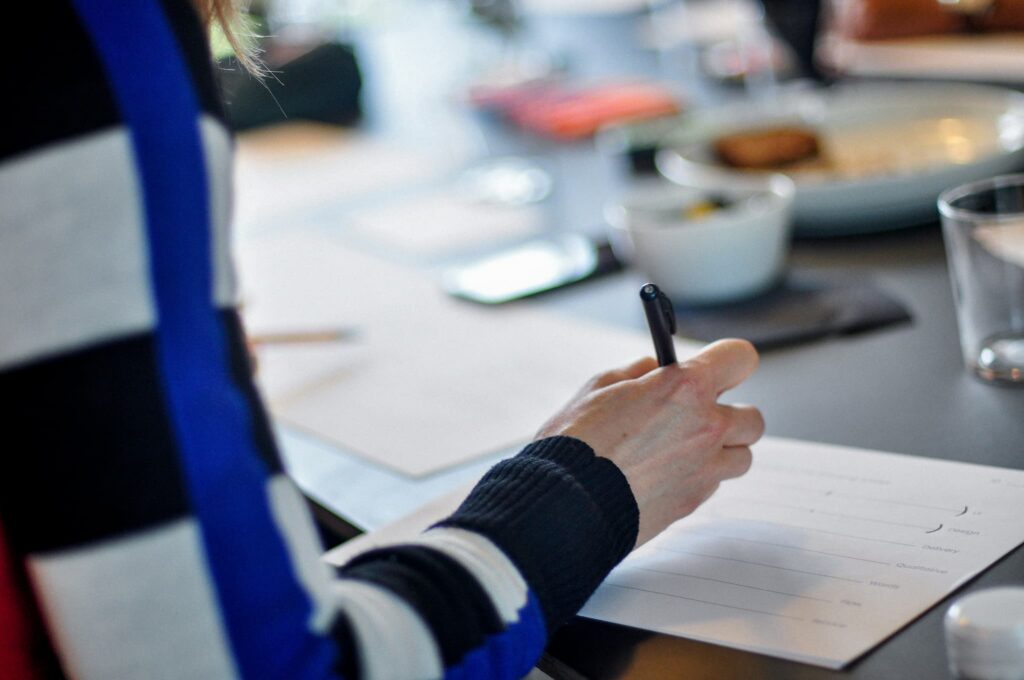 Person completing paperwork related to international protection responsibilities and application process
