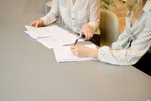 People completing forms during an application process